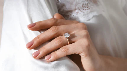 A woman wearing an engagement ring