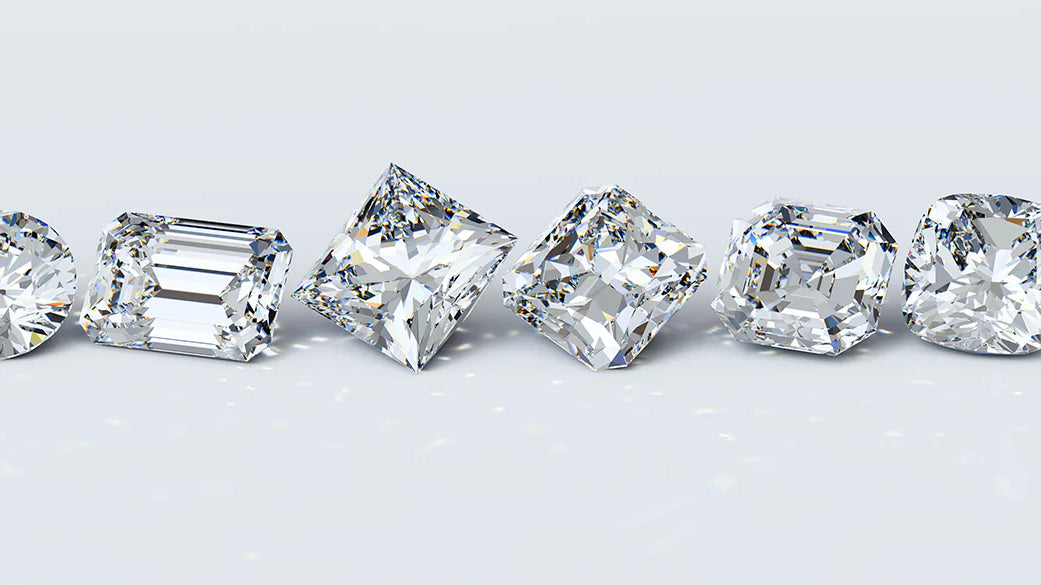 A collection of loose lab grown diamonds in various cuts, demonstrating the range of shapes and sizes available