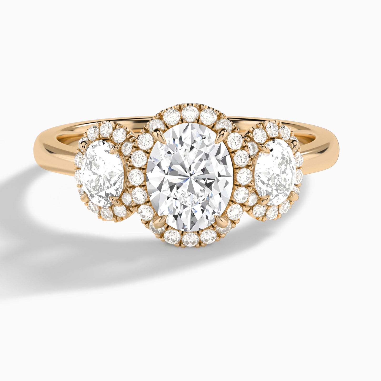 Oval Luxe Three Stone Halo Lab Diamond Engagement Ring In 14K Rose Gold - Lucenjuri