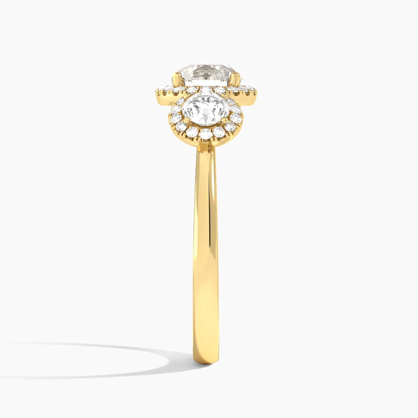 Round Luxe Three Stone Halo Lab Diamond Engagement Ring In 18K Yellow Gold, Side View