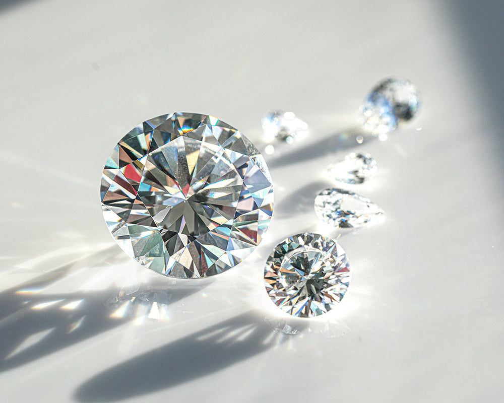 Close-up of round lab diamonds on a light background