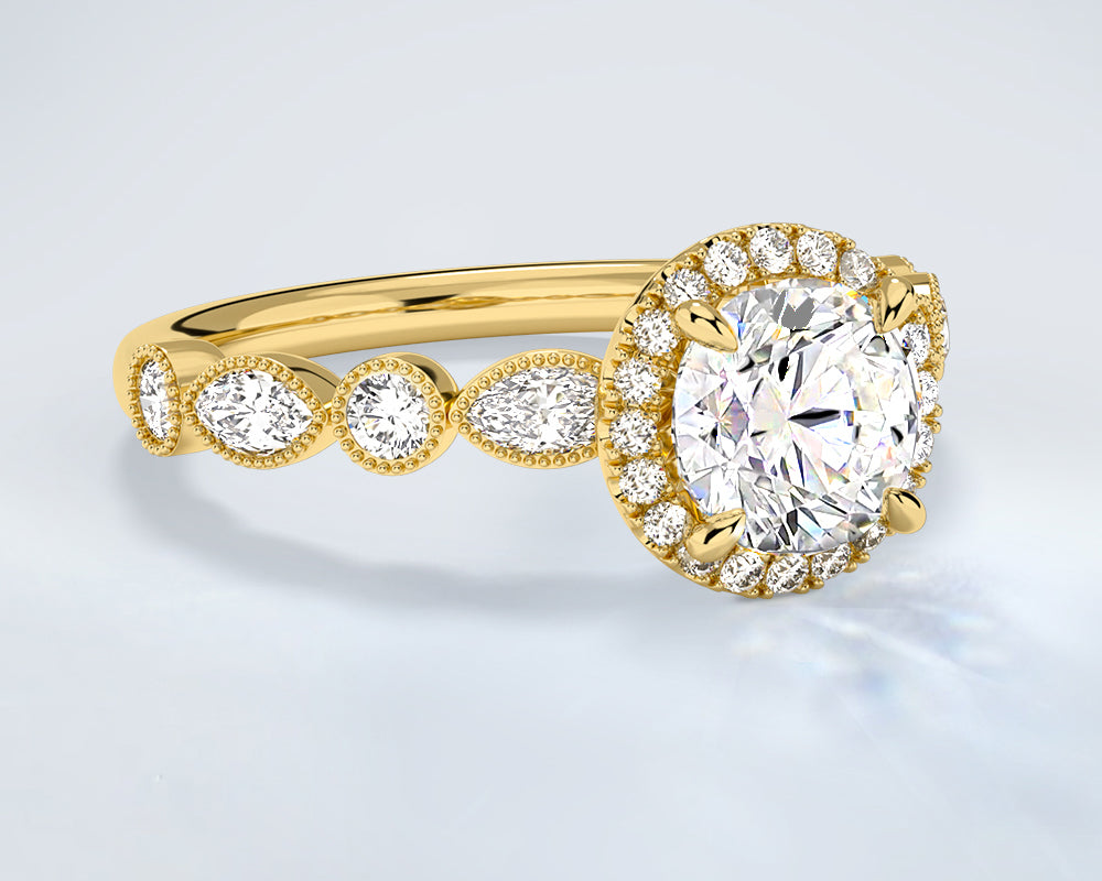 Gold engagement ring with a large lab diamond and smaller lab diamonds on a light gray background