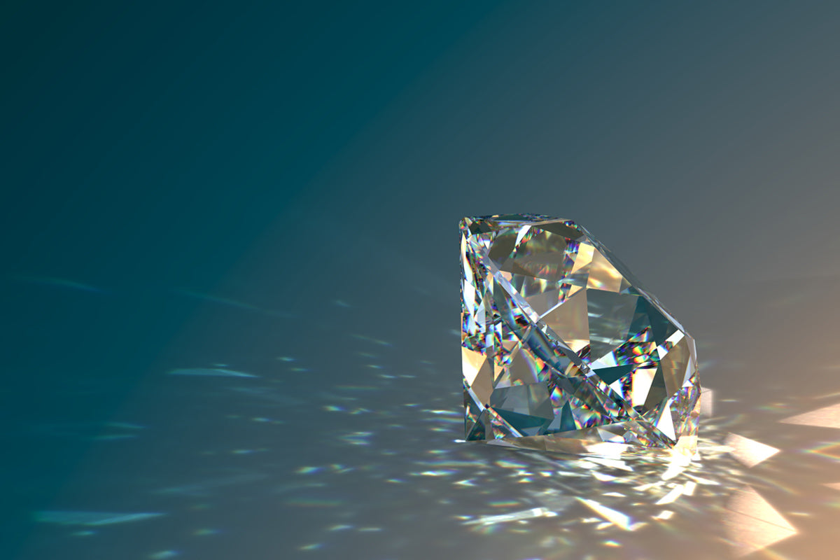 A sparkling diamond showcasing its brilliance and facets on a reflective surface