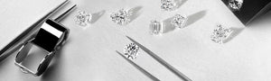 Loose diamonds and tools on a jeweler's workbench