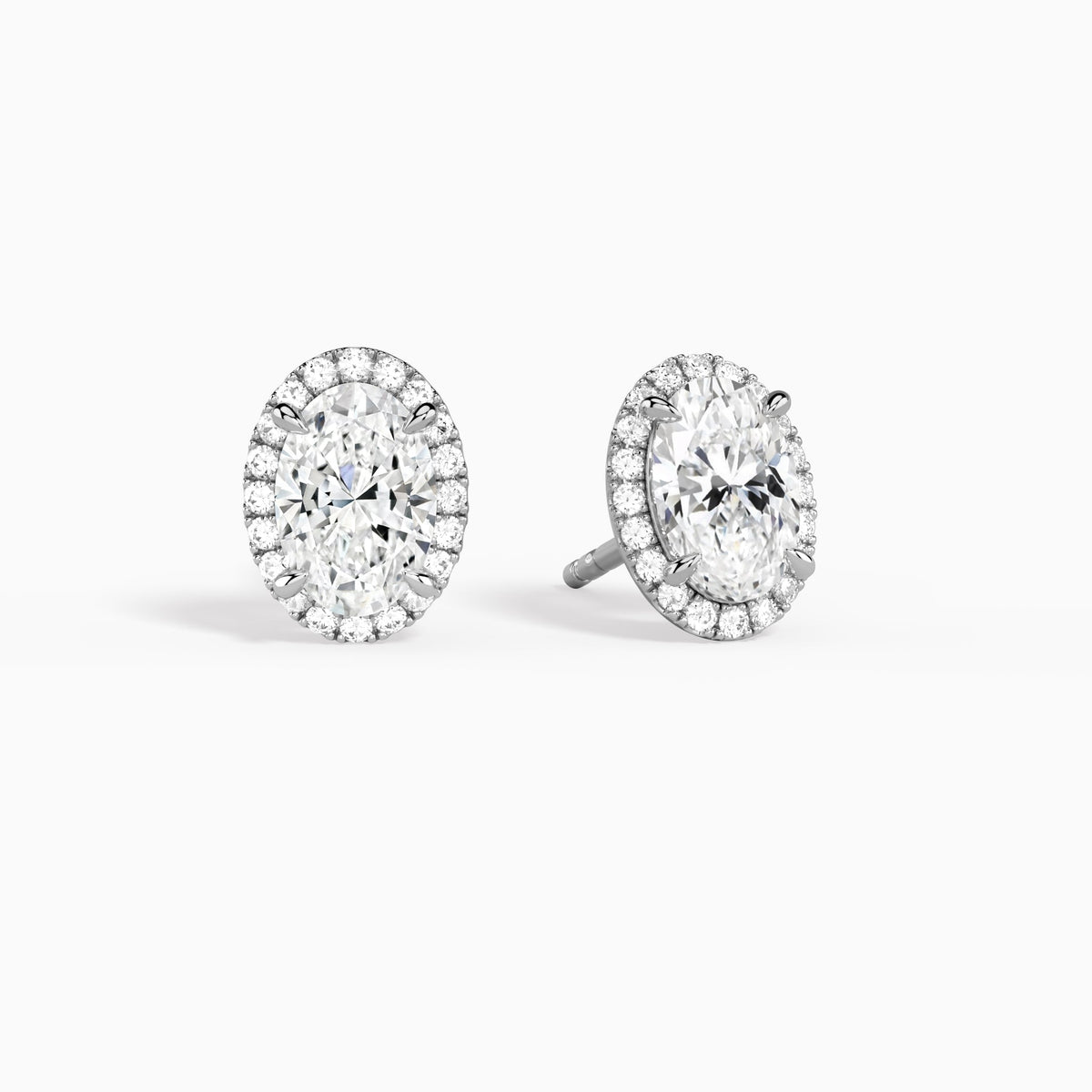 Oval Halo Diamond Stud Earrings in Platinum
