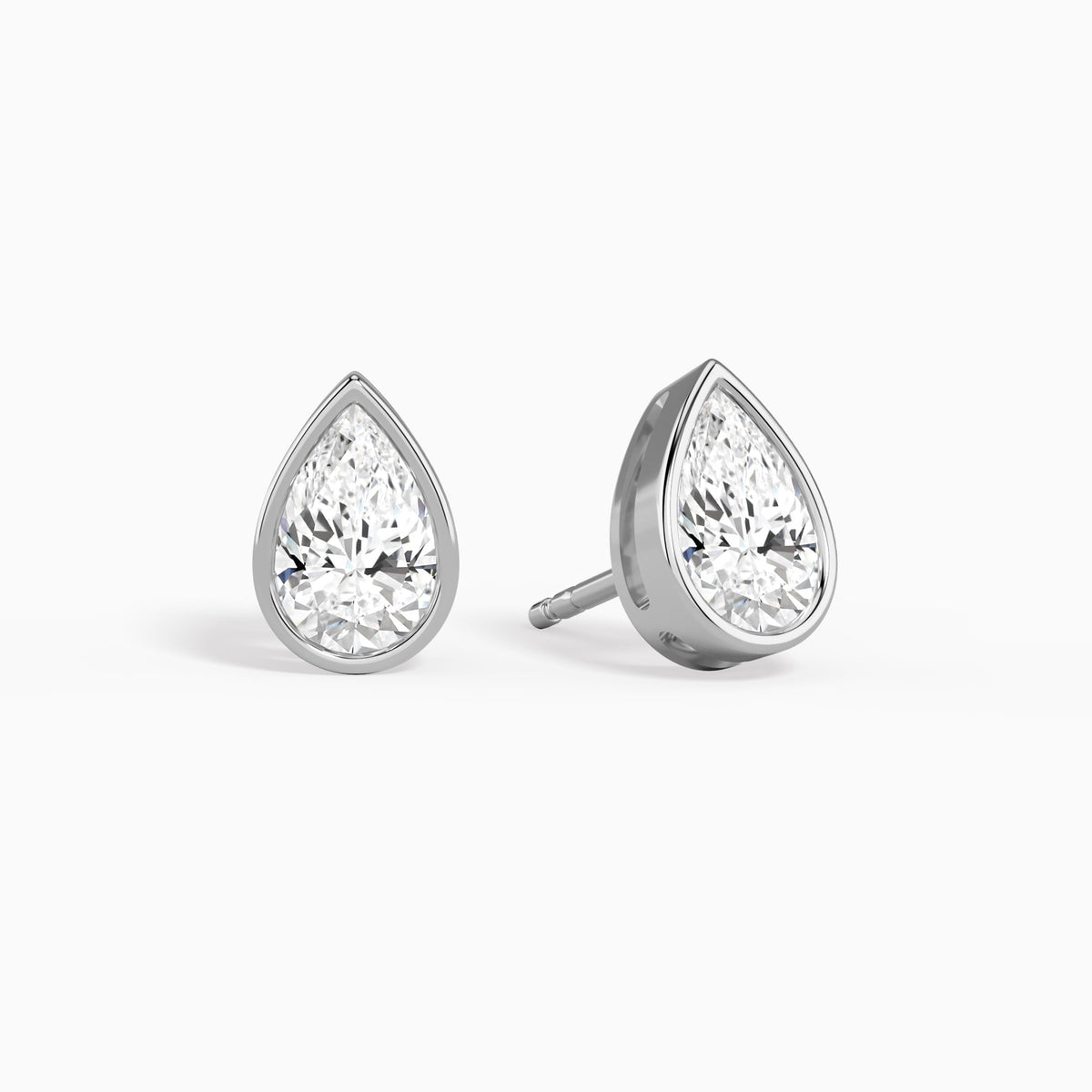 Pear Bezel Solitaire Diamond Stud Earrings in Platinum