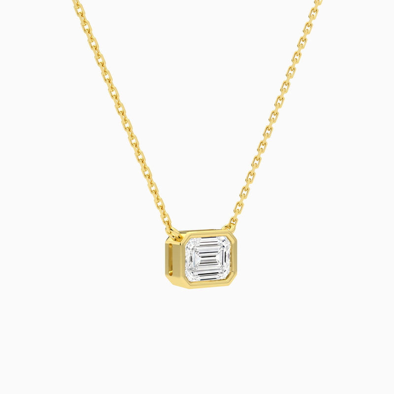 Bezel Solitaire Emerald Lab Grown Diamond Necklace In 14K Yellow Gold - Front Angle View