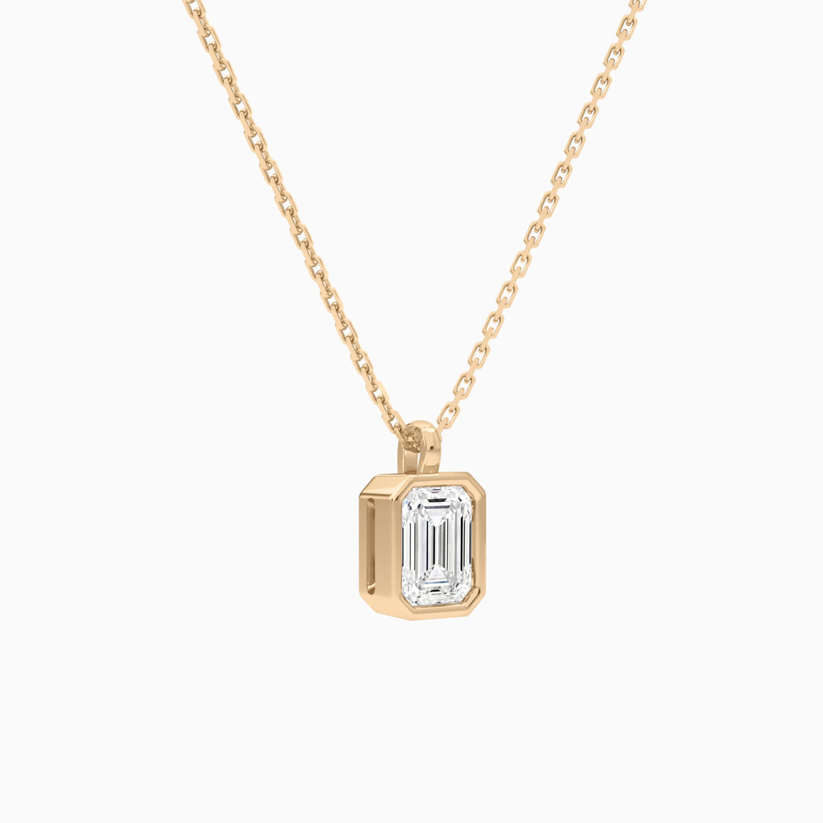 Bezel Solitaire Emerald Lab Grown Diamond Pendant Necklace In 14K Rose Gold - Front Angle View
