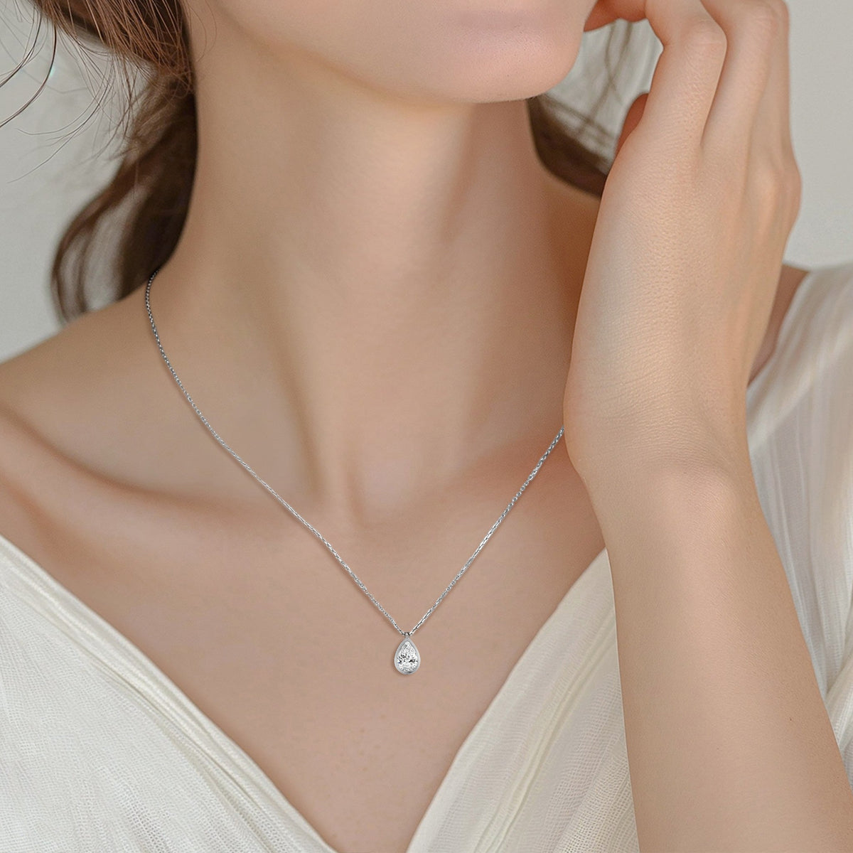 Bezel Solitaire Pear Lab Grown Diamond Pendant Necklace In 18K White Gold Shown Worn on Model