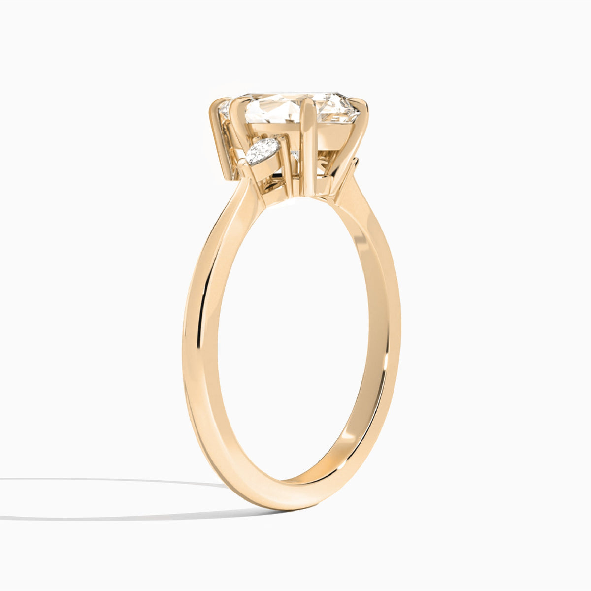 Pear Dulcie Three Stone Lab Diamond Engagement Ring In 14K Rose Gold, Angle View