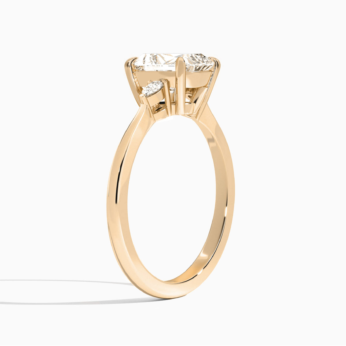 Radiant Dulcie Three Stone Lab Diamond Engagement Ring In 14K Rose Gold, Angle View