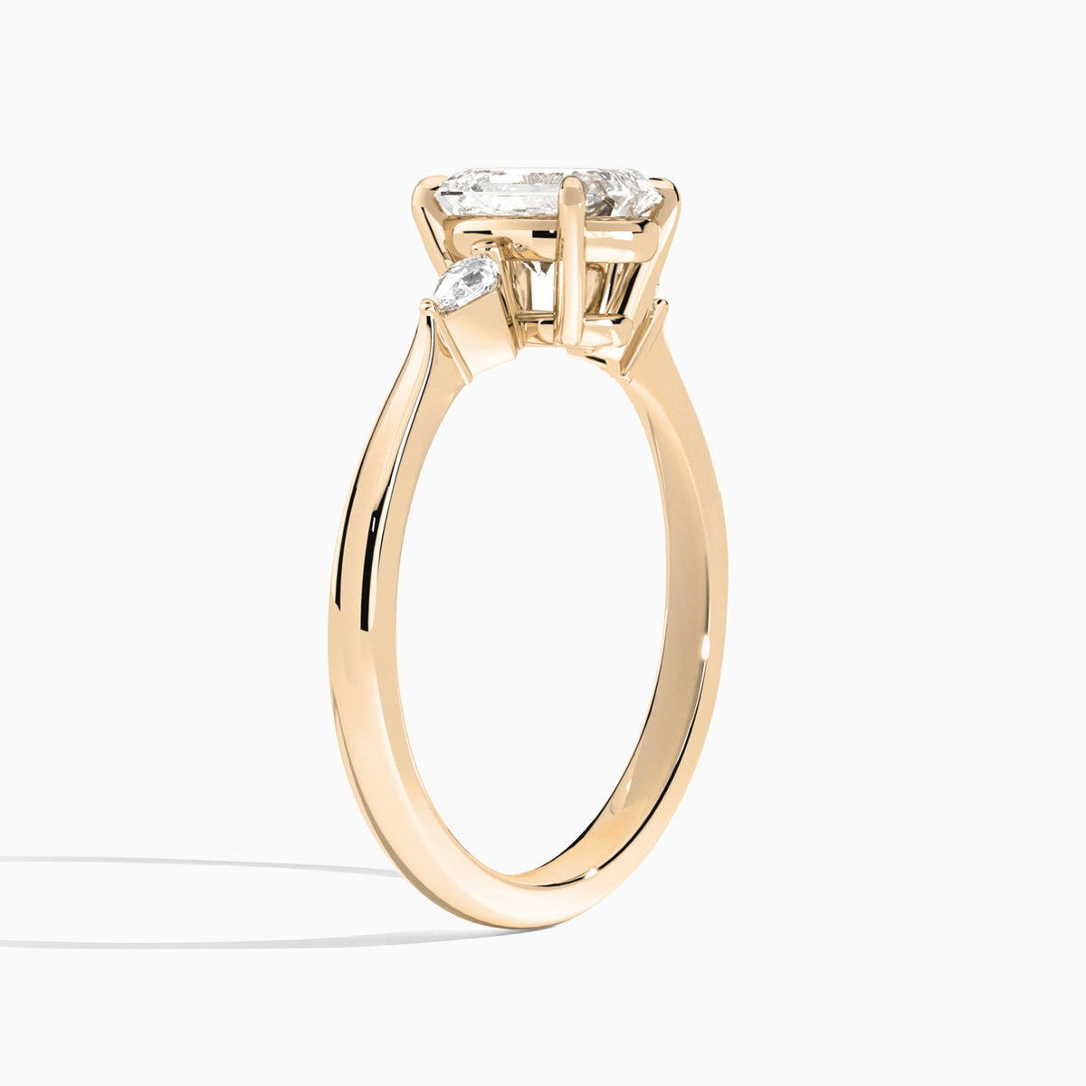 Emerald Three Stone Lab Diamond Engagement Ring In 14K Rose Gold, Angle View