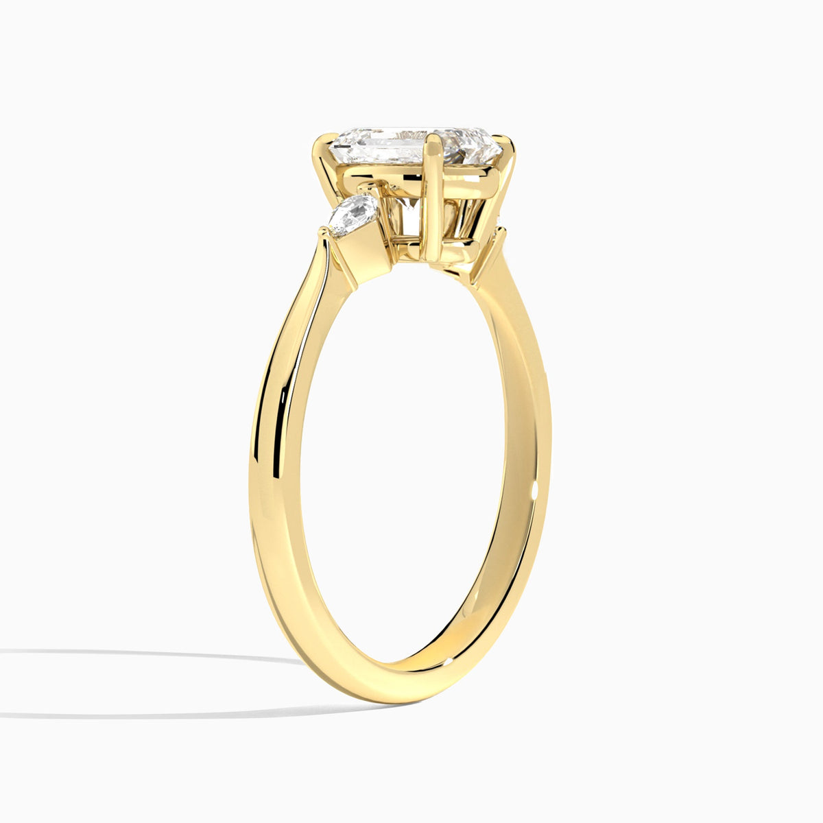 Emerald Three Stone Lab Diamond Engagement Ring In 18K Yellow Gold, Angle View