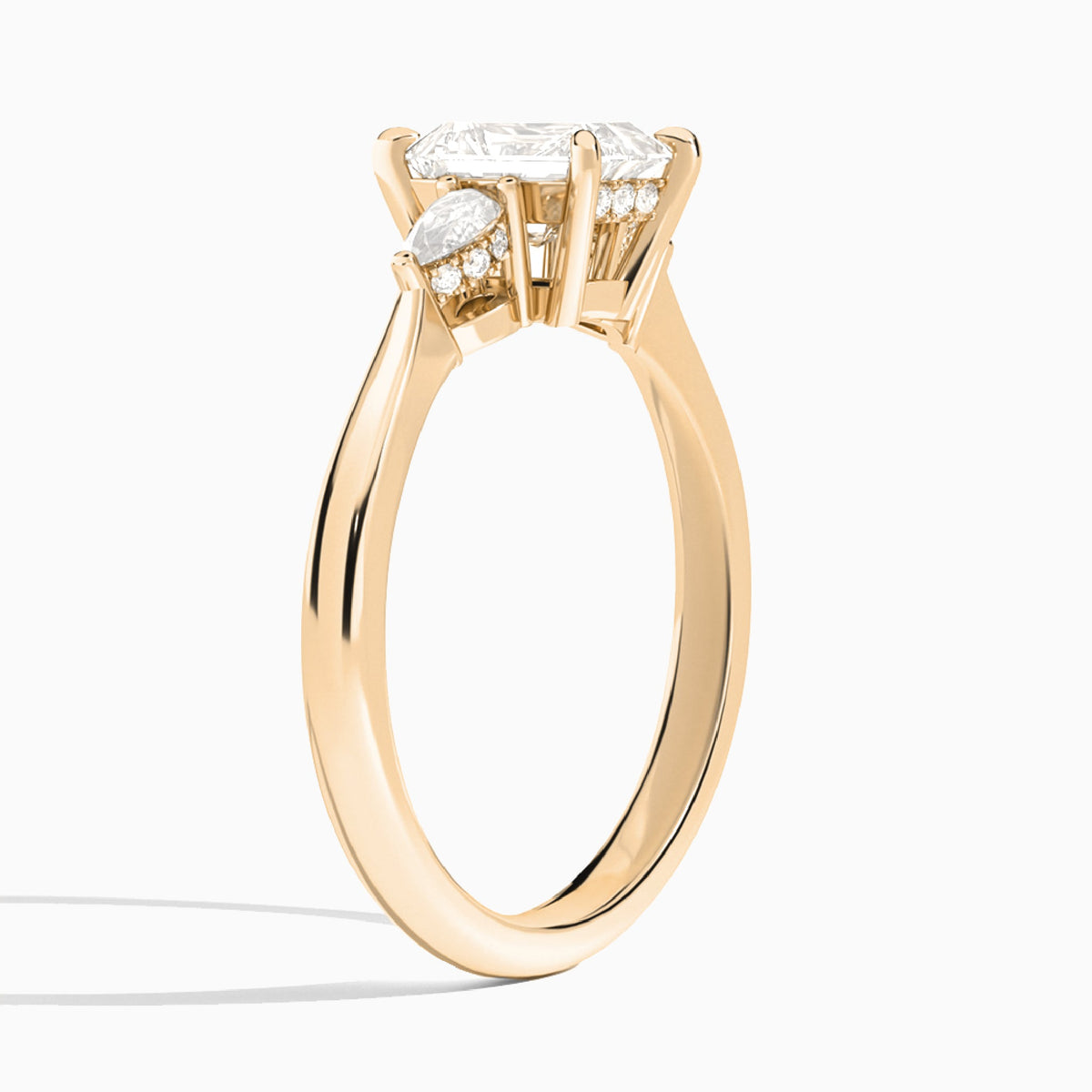 Emerald Adorned Couture Three Stone Lab Diamond Engagement Ring In 14K Rose Gold, Angle View