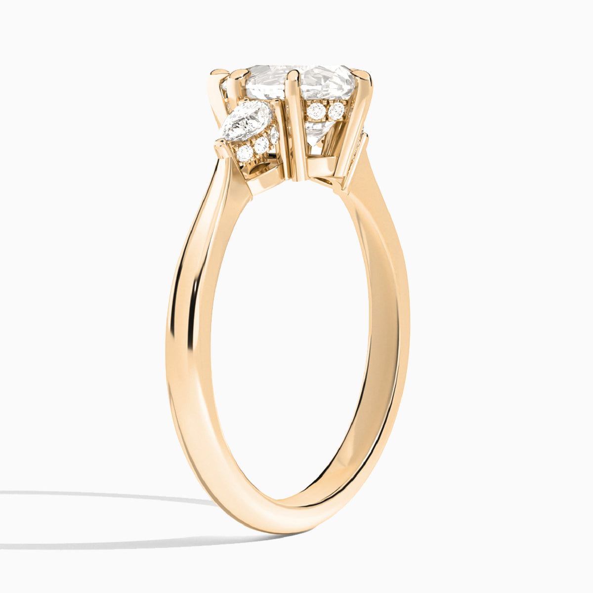 Pear Adorned Couture Three Stone Lab Diamond Engagement Ring In 14K Rose Gold, Angle View