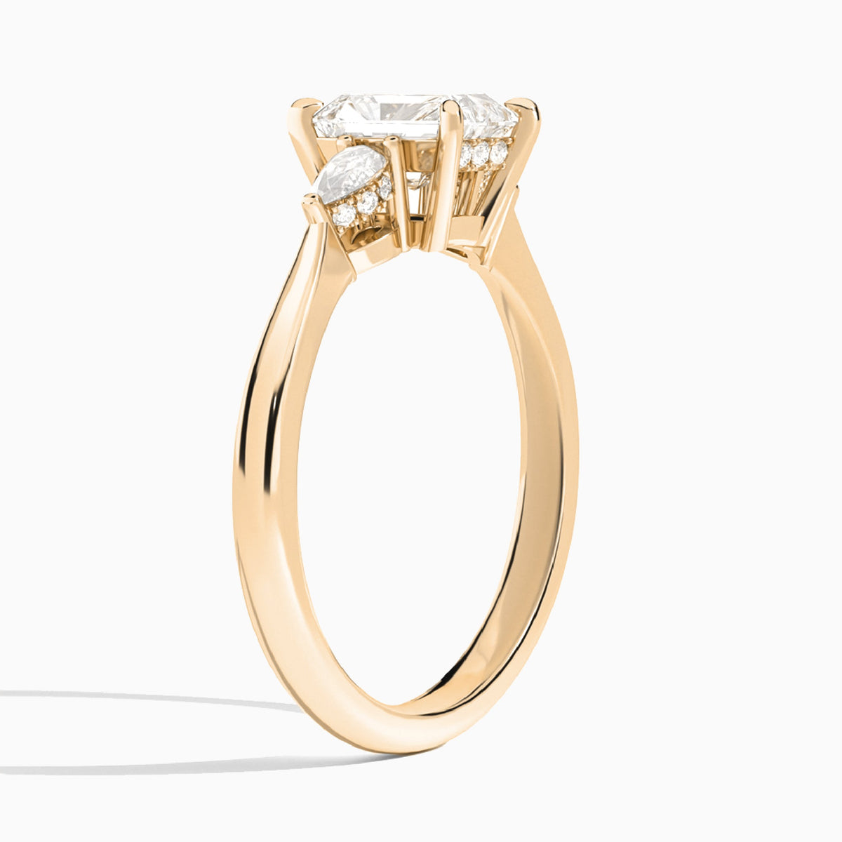 Radiant Adorned Couture Three Stone Lab Diamond Engagement Ring In 14K Rose Gold, Angle View