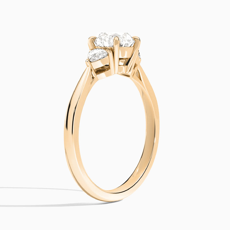 Round Luxe Trillion Cut Three Stone Lab Diamond Engagement Ring In 14K Rose Gold, Angle View