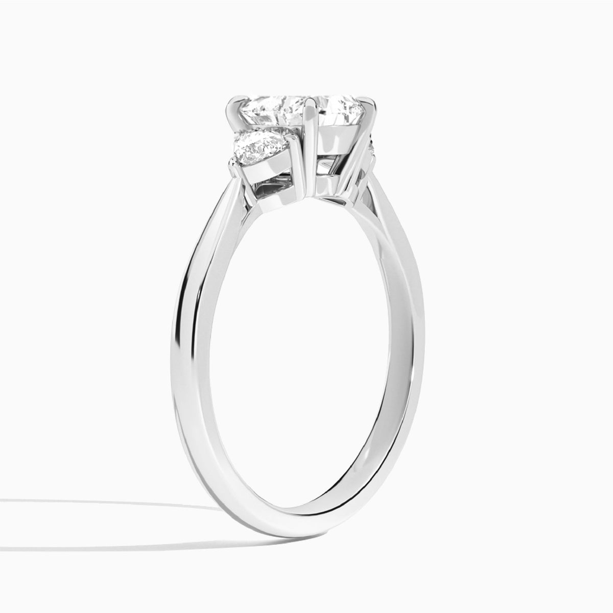 Heart Luxe Trillion Cut Three Stone Lab Diamond Engagement Ring In 18K White Gold, Angle View
