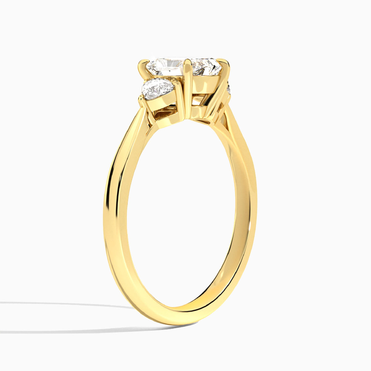 Radiant Luxe Trillion Cut Three Stone Lab Diamond Engagement Ring In 18K Yellow Gold, Angle View