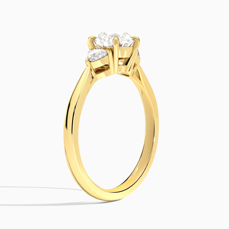 Round Luxe Trillion Cut Three Stone Lab Diamond Engagement Ring In 18K Yellow Gold, Angle View