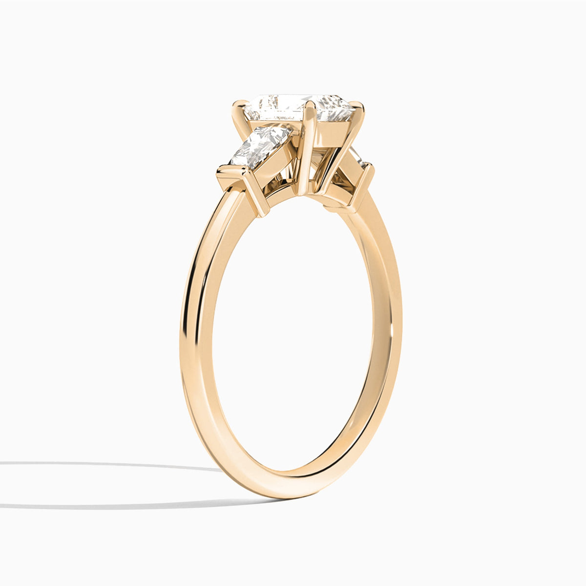 Radiant Thora Three Stone Lab Diamond Engagement Ring In 14K Rose Gold, Angle View