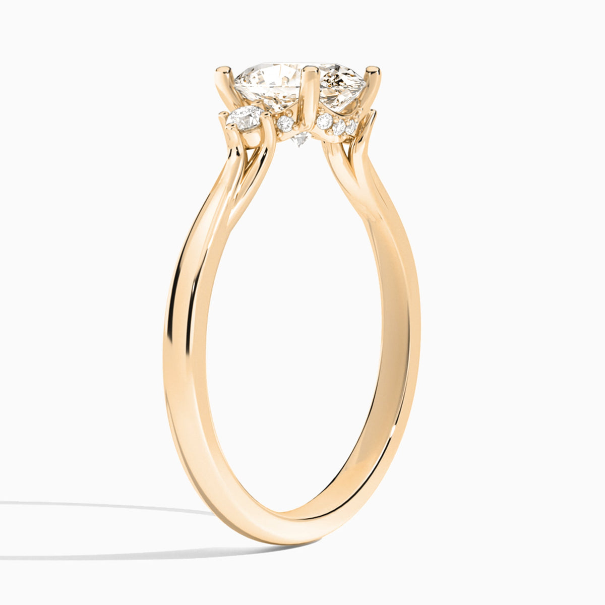 Oval Floating Three Stone Lab Diamond Engagement Ring In 14K Rose Gold, Angle View