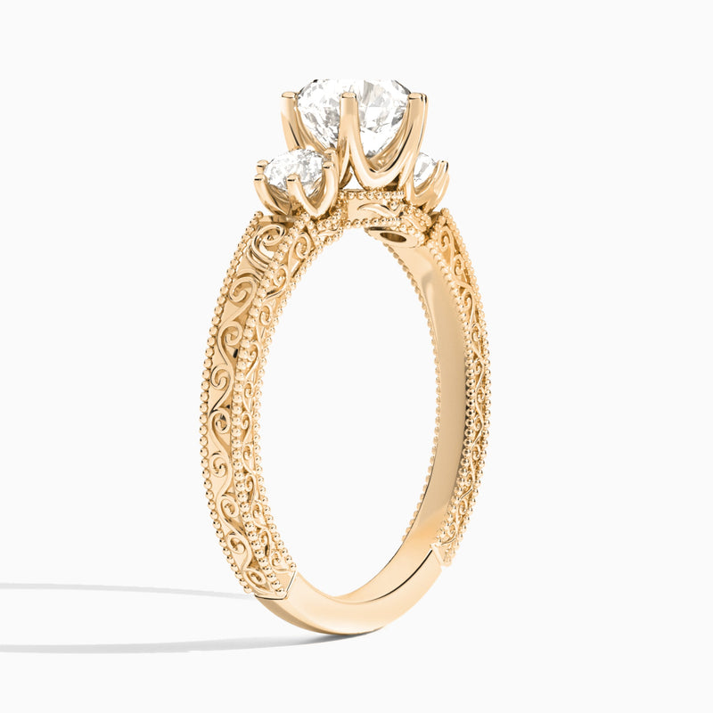 Round Three Stone Engraved Lab Diamond Engagement Ring In 14K Rose Gold, Angle View