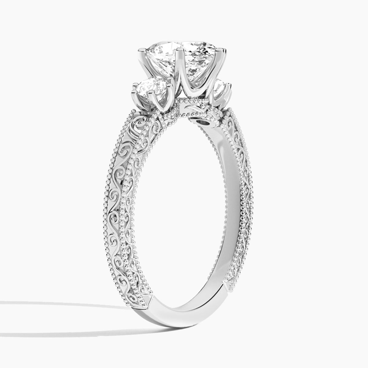 Oval Three Stone Engraved Lab Diamond Engagement Ring In 18K White Gold, Angle View