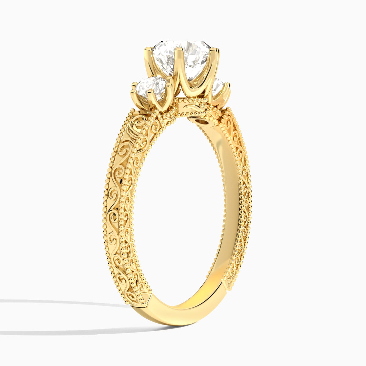 Round Three Stone Engraved Lab Diamond Engagement Ring In 18K Yellow Gold, Angle View