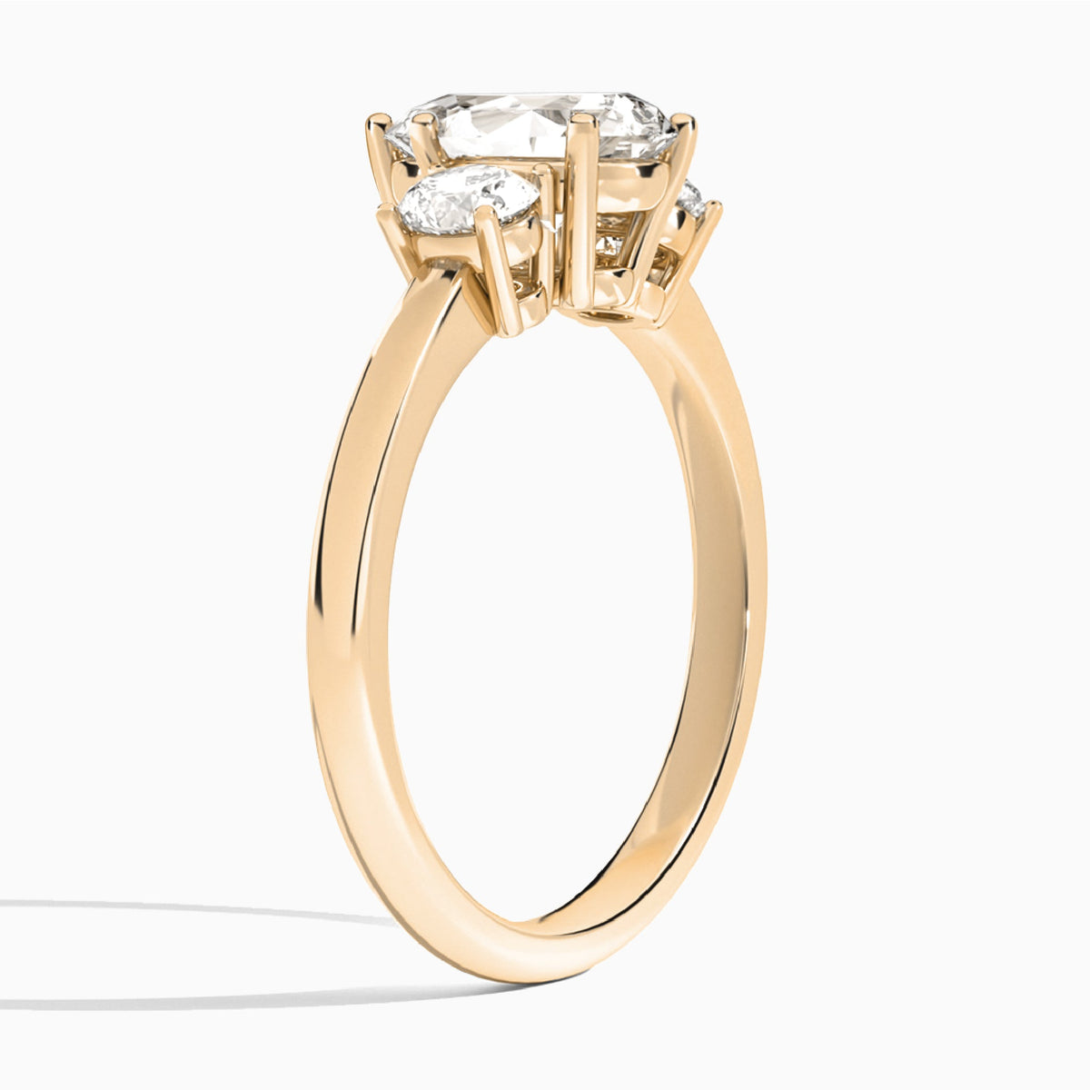 Pear Sonata Three Stone Lab Diamond Engagement Ring In 14K Rose Gold, Angle View