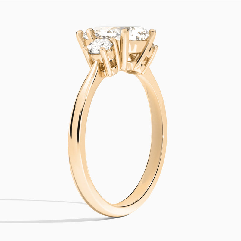 Pear Concerto Three Stone Lab Diamond Engagement Ring In 14K Rose Gold, Angle View
