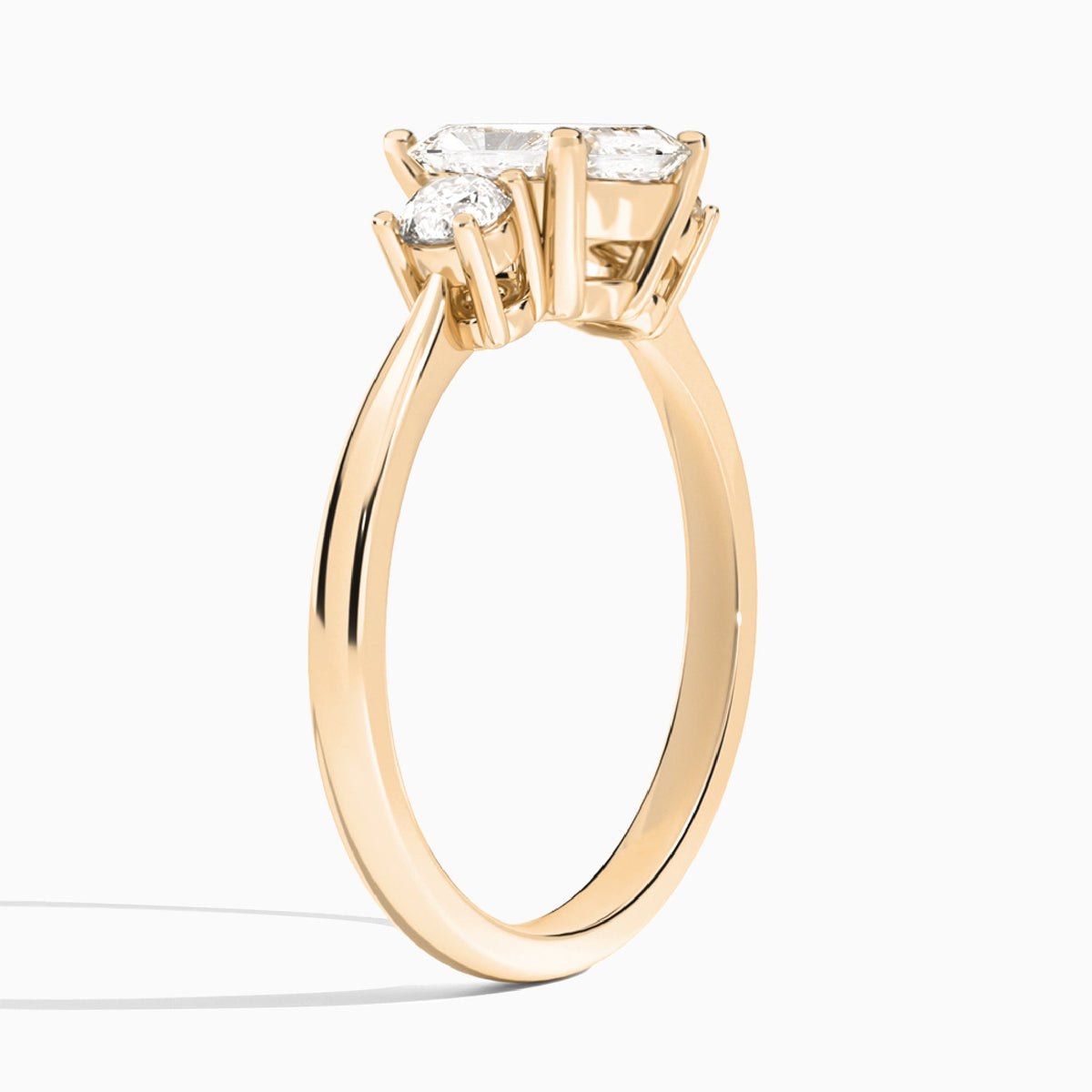 Radiant Concerto Three Stone Lab Diamond Engagement Ring In 14K Rose Gold, Angle View