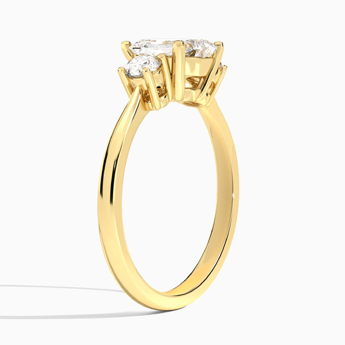 Emerald Concerto Three Stone Lab Diamond Engagement Ring In 18K Yellow Gold, Angle View