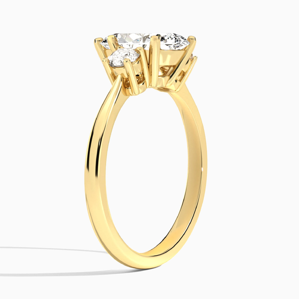 Marquise Concerto Three Stone Lab Diamond Engagement Ring In 18K Yellow Gold, Angle View