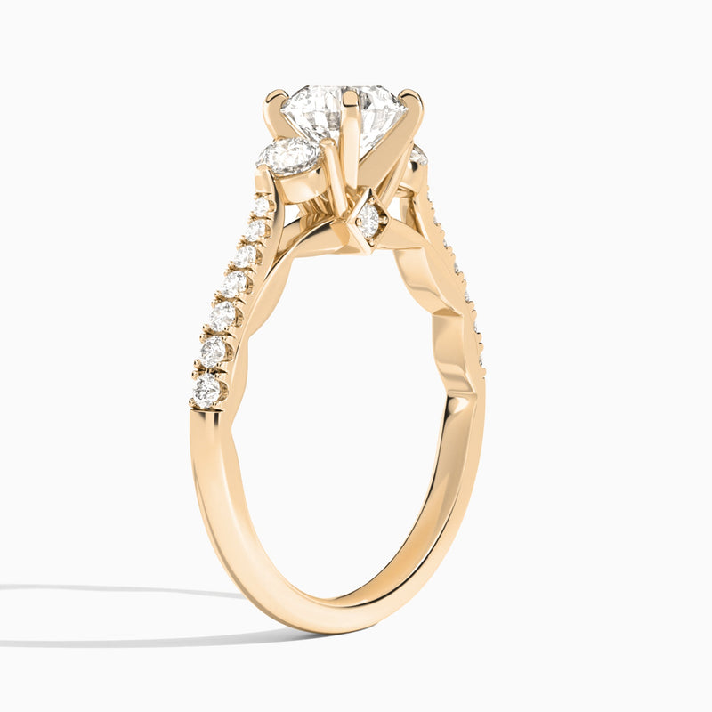 Round Tressa Three Stone Lab Diamond Engagement Ring In 14K Rose Gold, Angle View