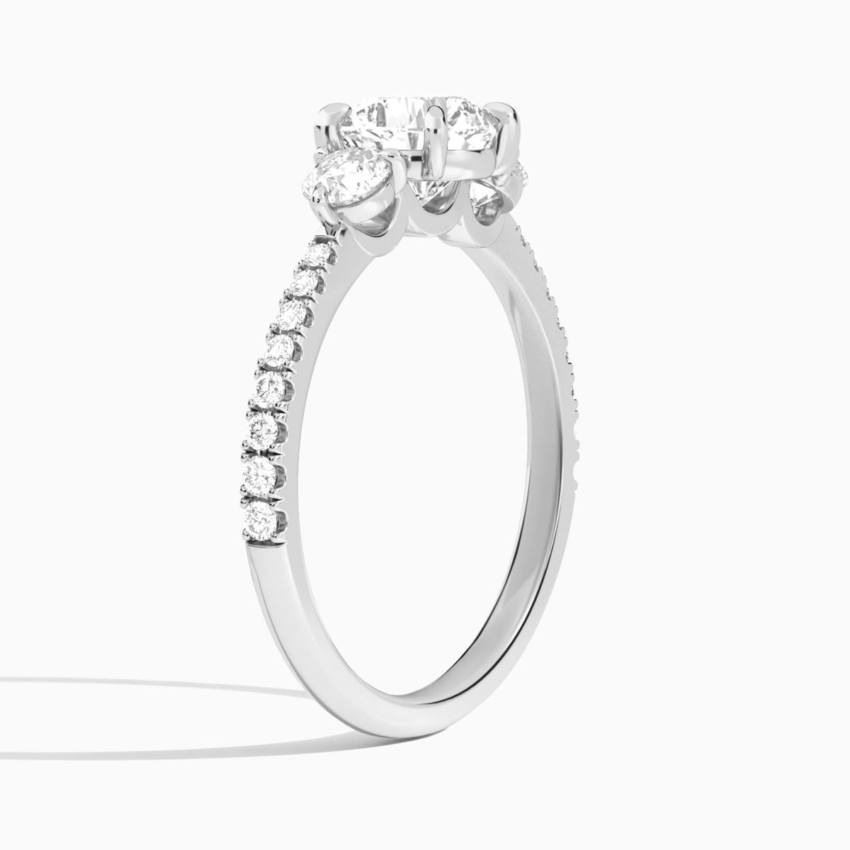 Cushion Luxe Three Stone Pavé Lab Diamond Engagement Ring In Platinum, Angle View