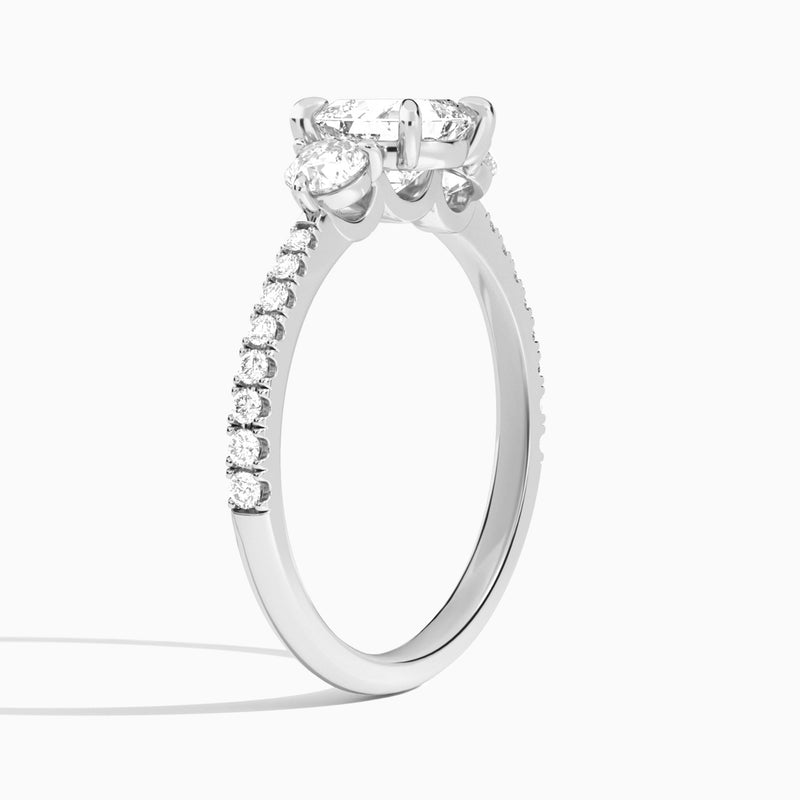 Asscher Luxe Three Stone Pavé Lab Diamond Engagement Ring In 18K White Gold, Angle View