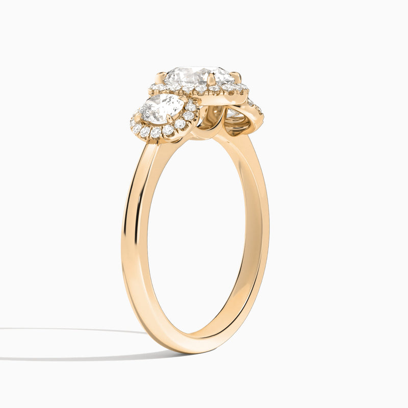 Oval Luxe Three Stone Halo Lab Diamond Engagement Ring In 14K Rose Gold, Angle View