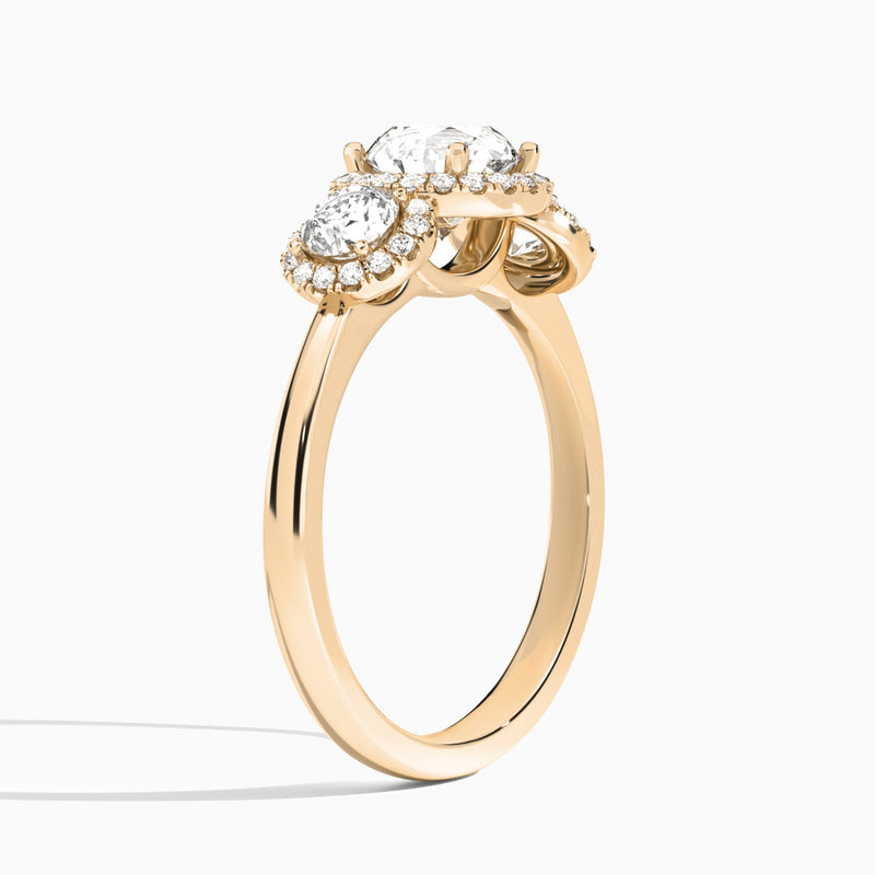 Round Luxe Three Stone Halo Lab Diamond Engagement Ring In 14K Rose Gold, Angle View