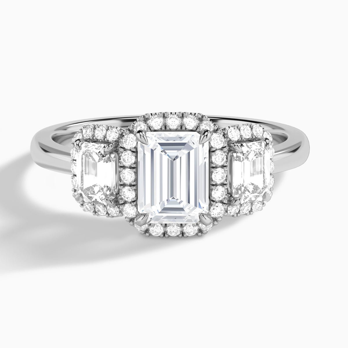 Emerald Luxe Three Stone Halo Lab Diamond Engagement Ring In 18K White Gold - Lucenjuri
