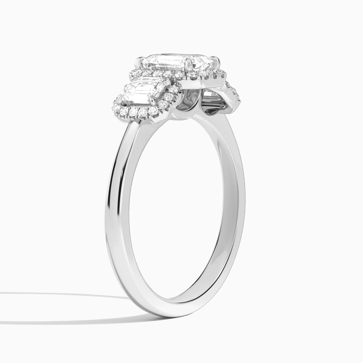 Emerald Luxe Three Stone Halo Lab Diamond Engagement Ring In 14K White Gold, Angle View