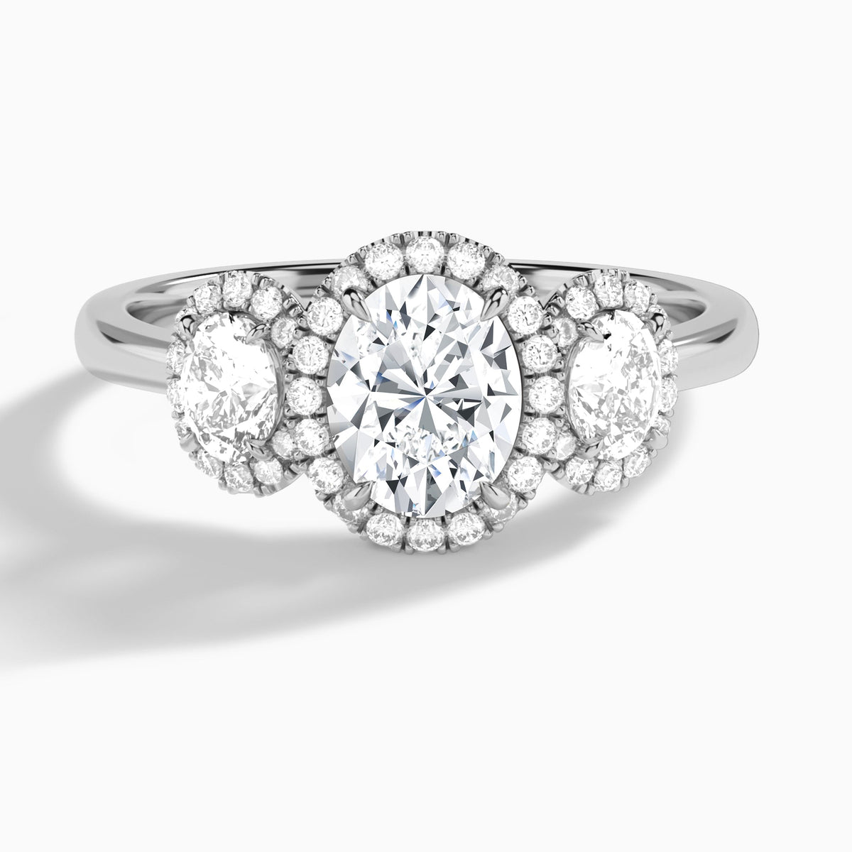 Oval Luxe Three Stone Halo Lab Diamond Engagement Ring In 18K White Gold - Lucenjuri
