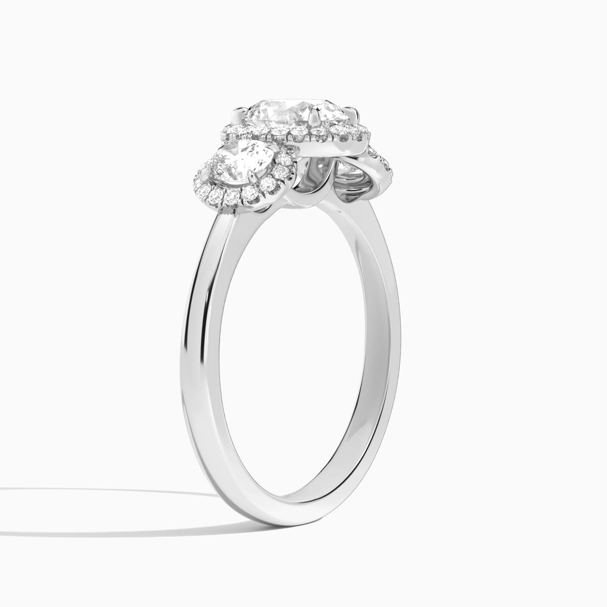 Oval Luxe Three Stone Halo Lab Diamond Engagement Ring In 18K White Gold, Angle View