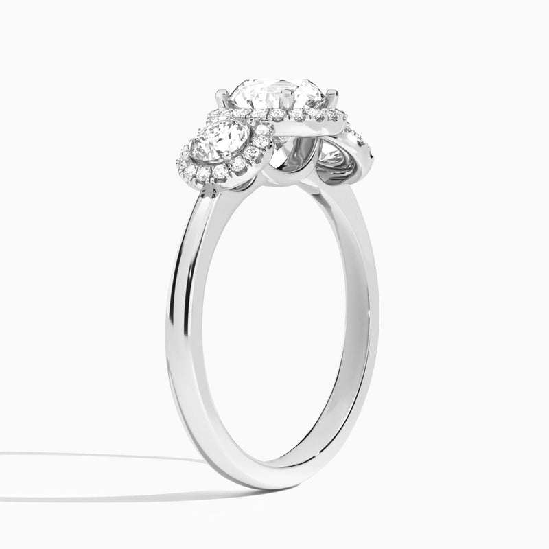Round Luxe Three Stone Halo Lab Diamond Engagement Ring In 18K White Gold, Angle View