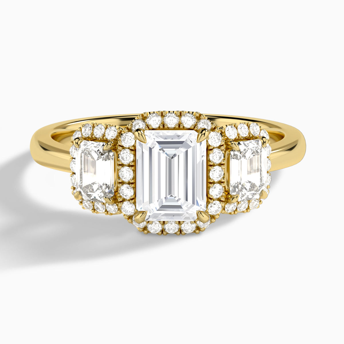 Emerald Luxe Three Stone Halo Lab Diamond Engagement Ring In 14K Yellow Gold - Lucenjuri