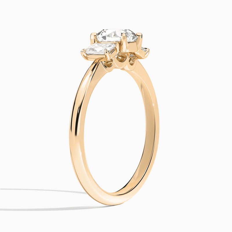 Round Three Stone Emerald Lab Diamond Engagement Ring In 14K Rose Gold, Angle View