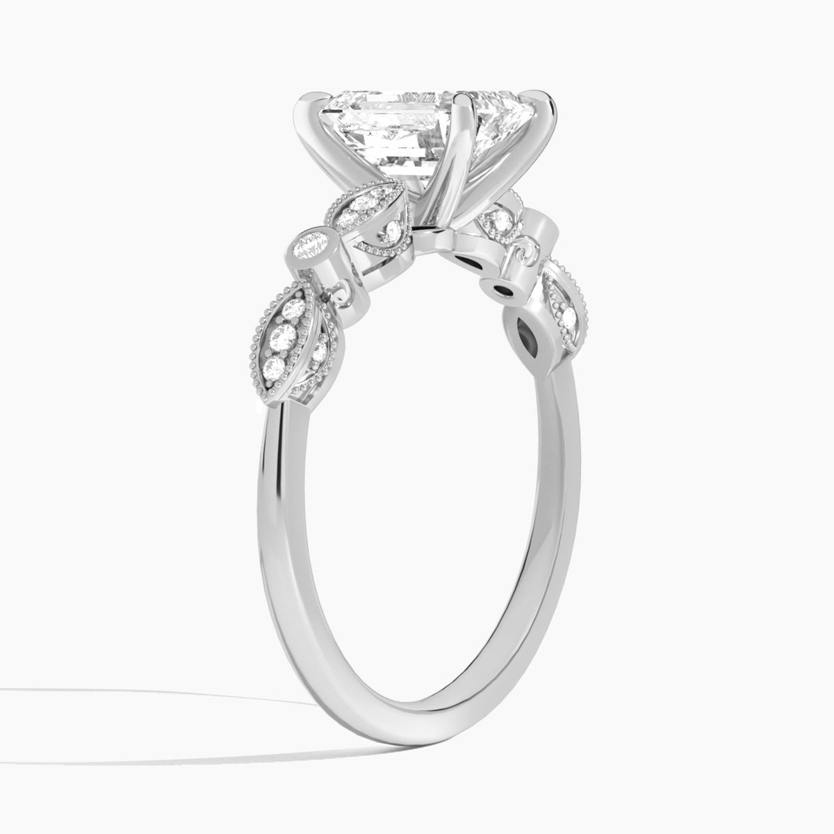 Emerald Infinito Bezel And Pavé Set Engagement Ring In Platinum, Angle View
