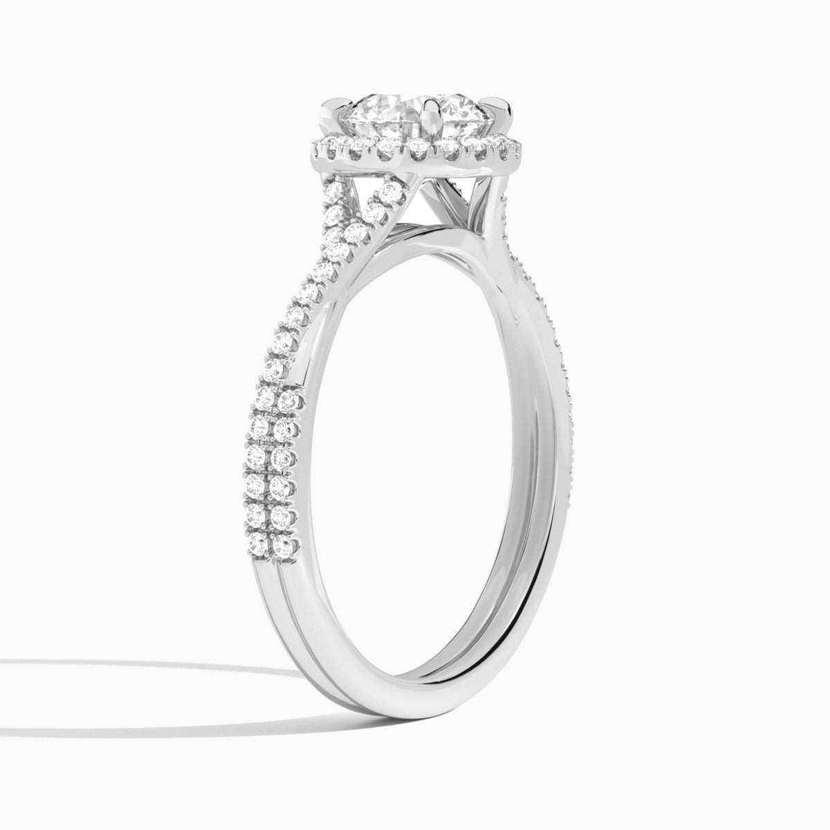 Round Luxe Halo And Twisted Shank Lab Diamond Engagement Ring In 18K White Gold, Angle View