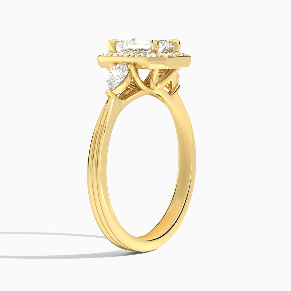 Emerald Halo Shaped Side Stone Lab Diamond Engagement Ring In 14K Yellow Gold, Angle View