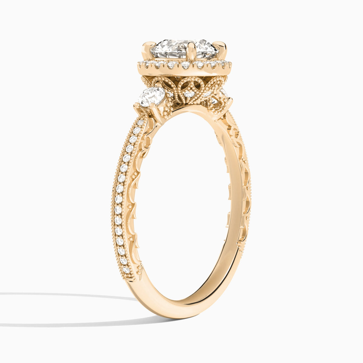 Round Luxe Three Stone Lab Diamond Engagement Ring In 14K Rose Gold, Angle View